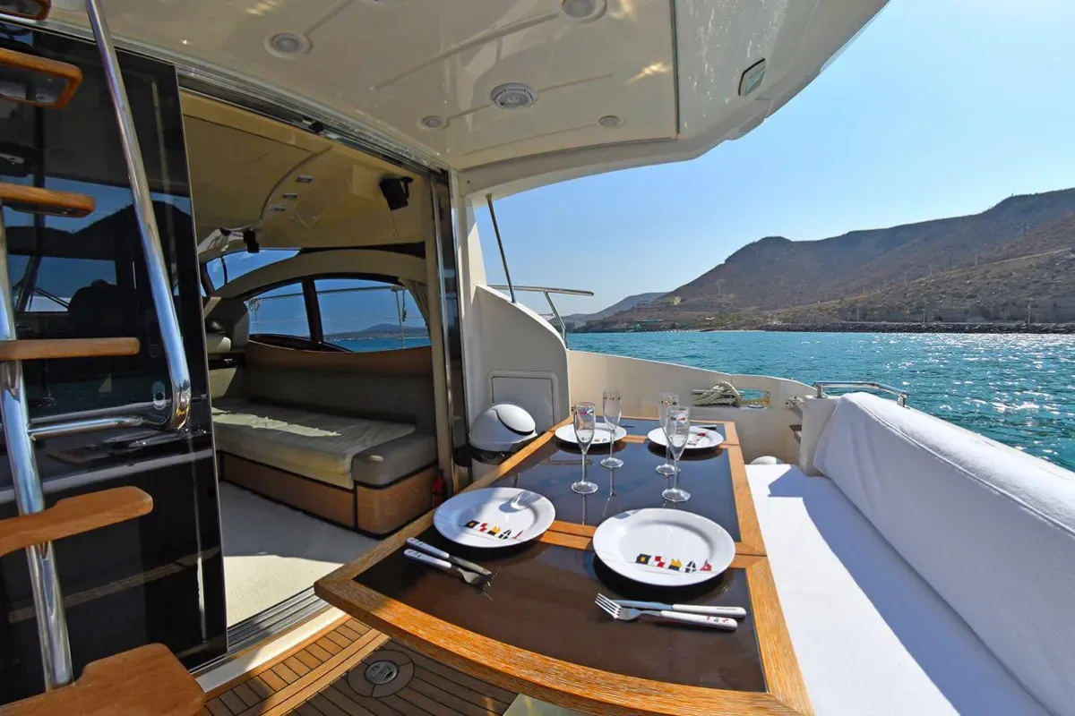 Table set for lunch on deck with a view of the mountains