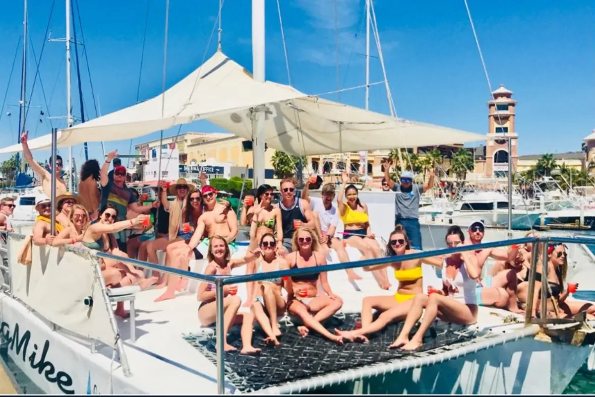 Group of friends on the trimaran at the marina
