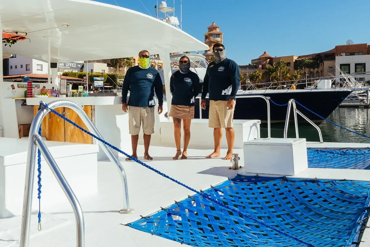 Crew welcoming guests at the marina