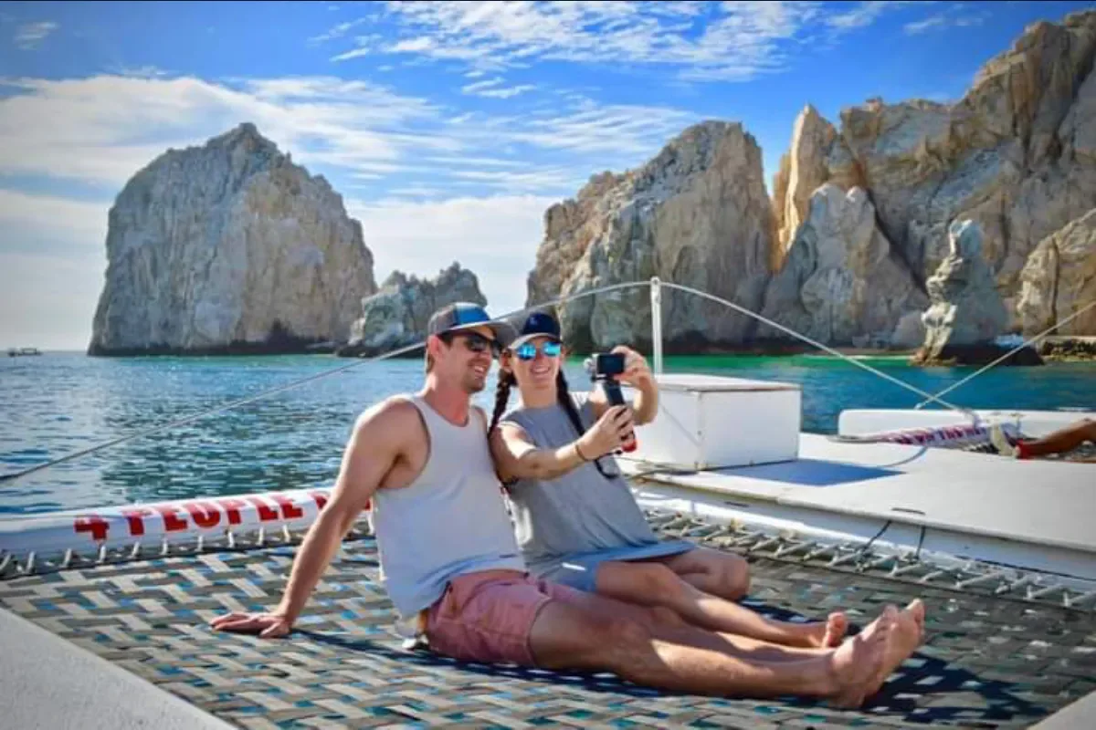 Couple relaxing on the bow netting