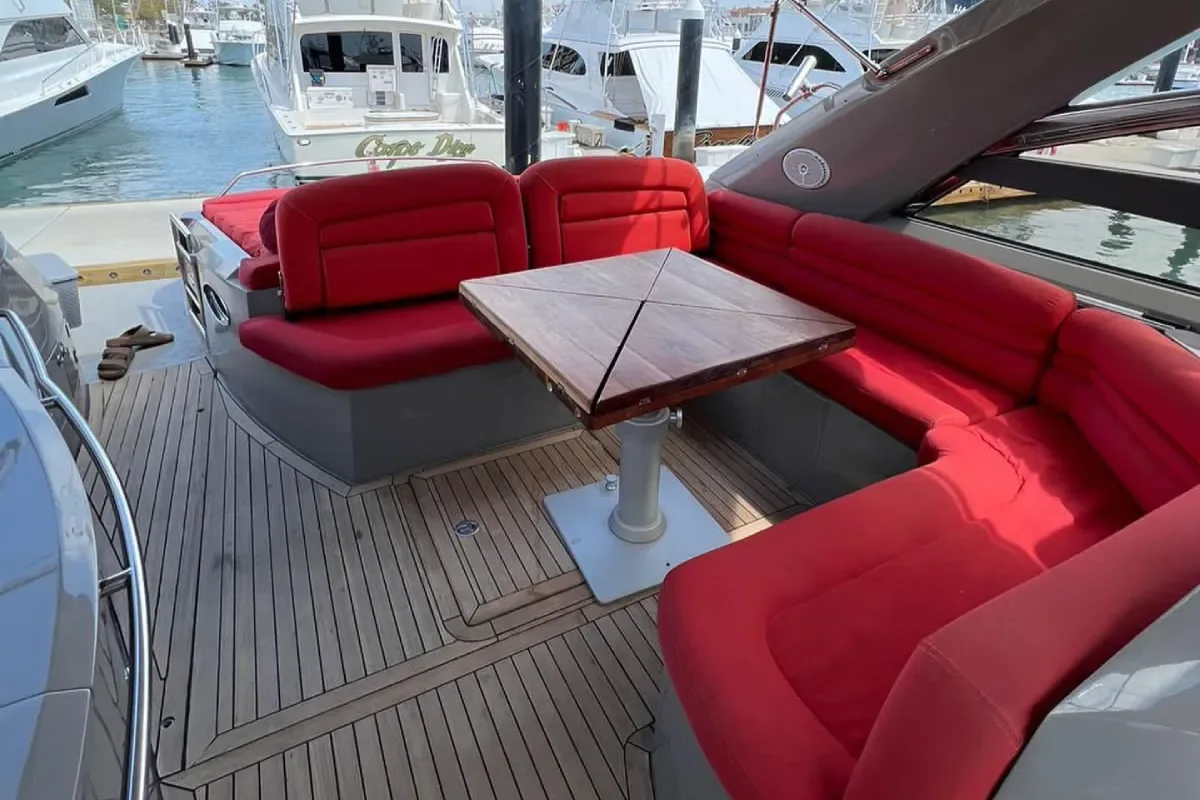 Cockpit with red seating and a table